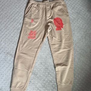 LONELY GHOST - self love club pants. Size medium. Tan and red